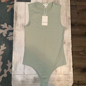 New with tags sage green bodysuit. Size small but runs a little big